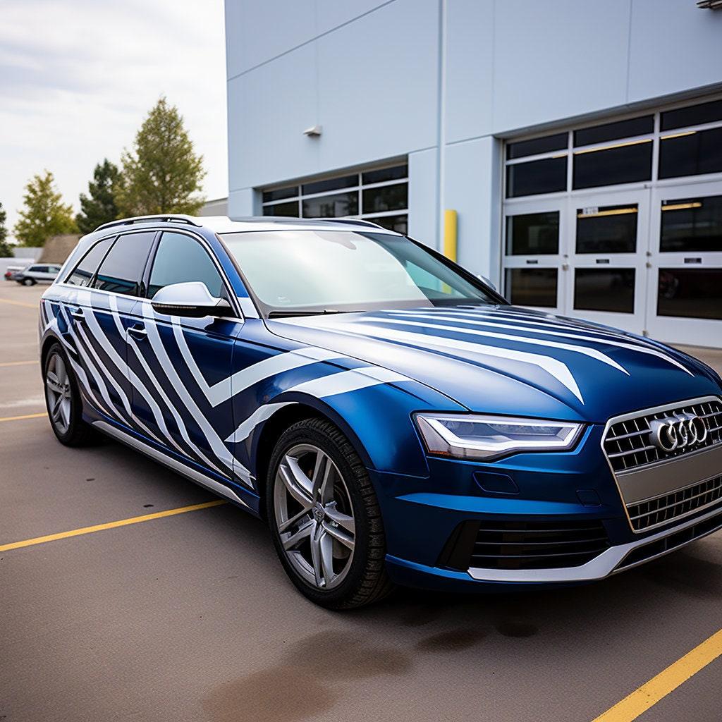 Blue Audi car with geometric white vinyl stripes on the side, showcasing stylish auto decals.