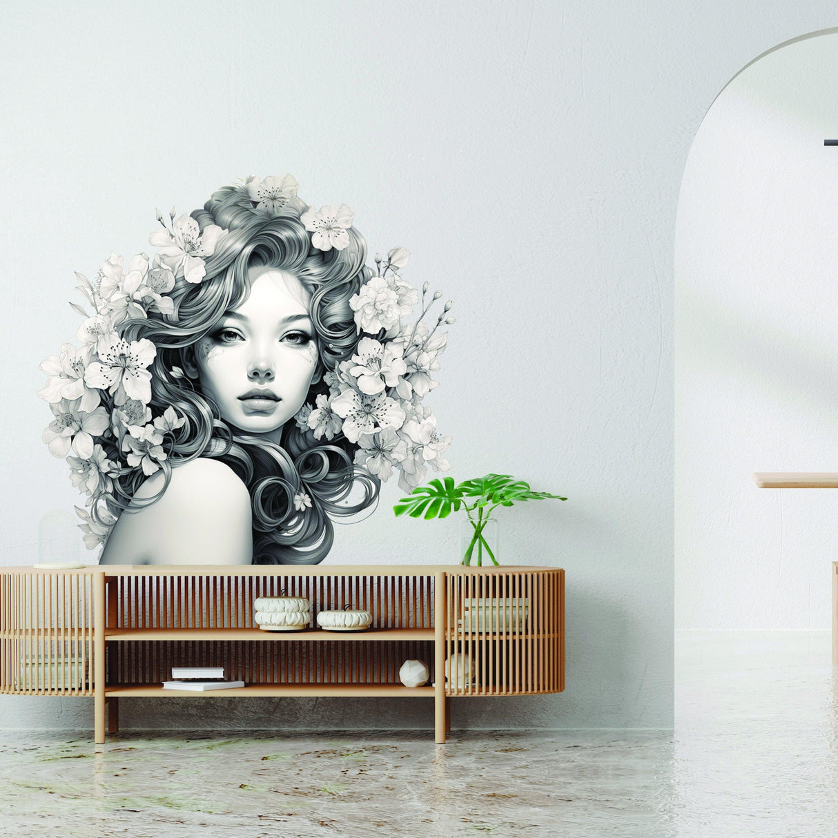 Elegant woman with floral mind decal on wall above modern wooden console, showcasing nature-inspired vinyl wall art.