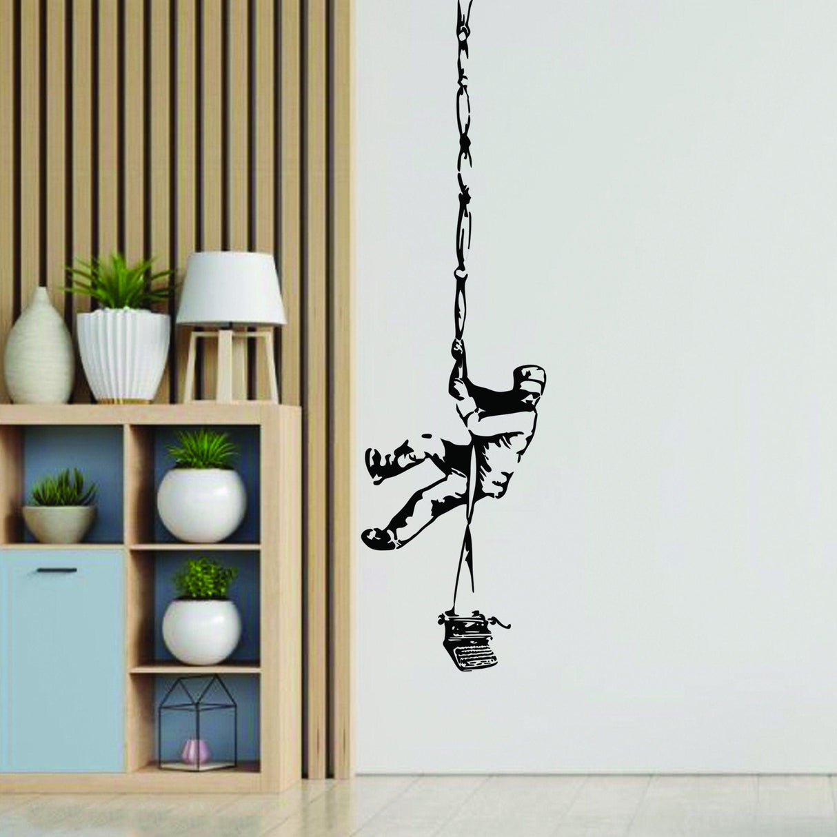 Banksy Prisoner Escape Wall Decal, graffiti-style vinyl sticker hanging in modern living space.