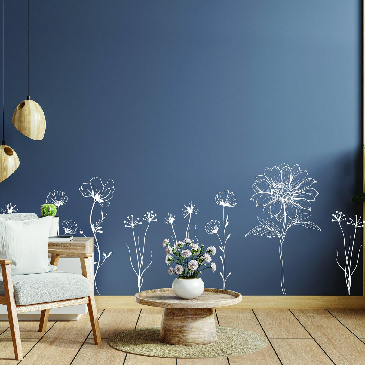 Elegant hand-sketched British wildflower wall stickers adorning a navy wall in a cozy living room.