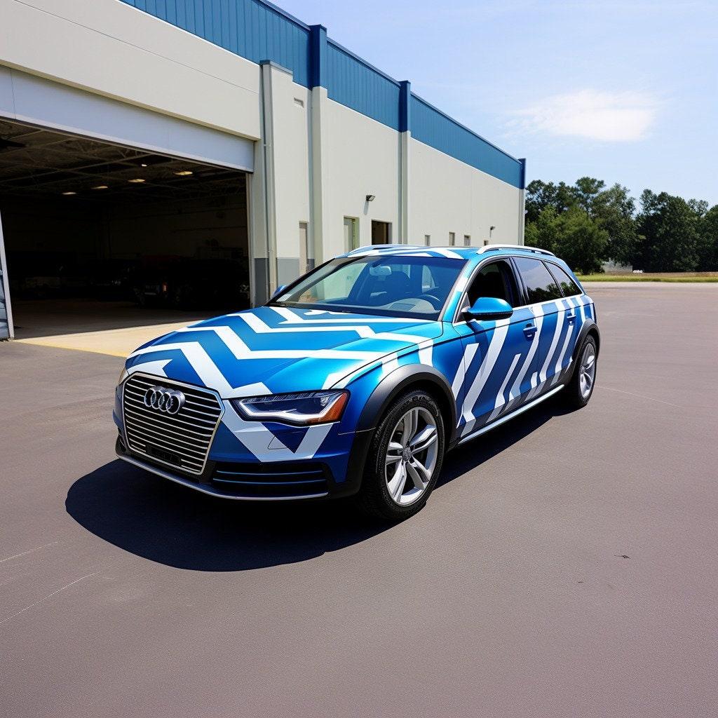 Stylish Audi vehicle wrapped in blue and white geometric vinyl decals showcasing bold design.