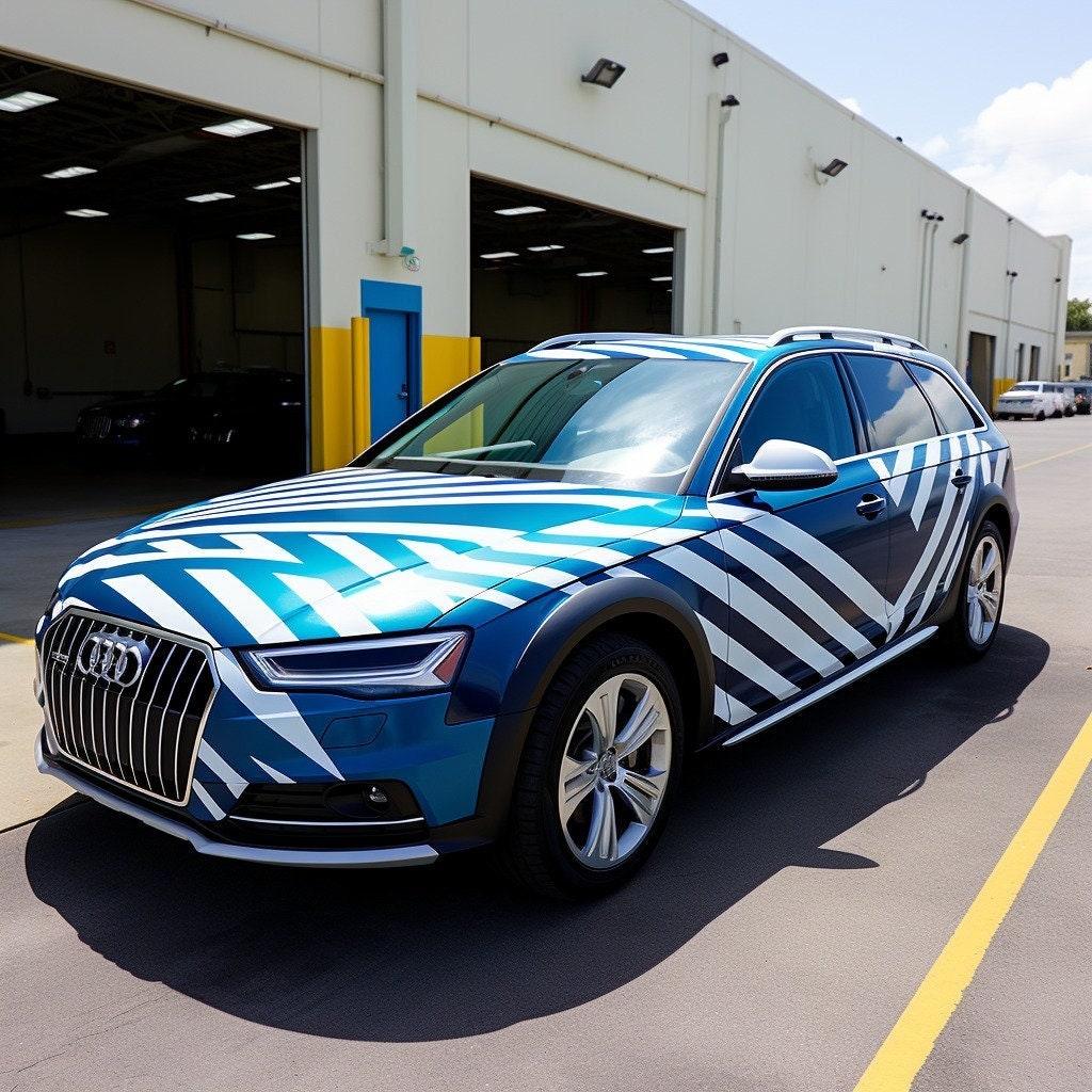 Stylish blue and white geometric vinyl decals on an Audi car, enhancing its modern look and design.