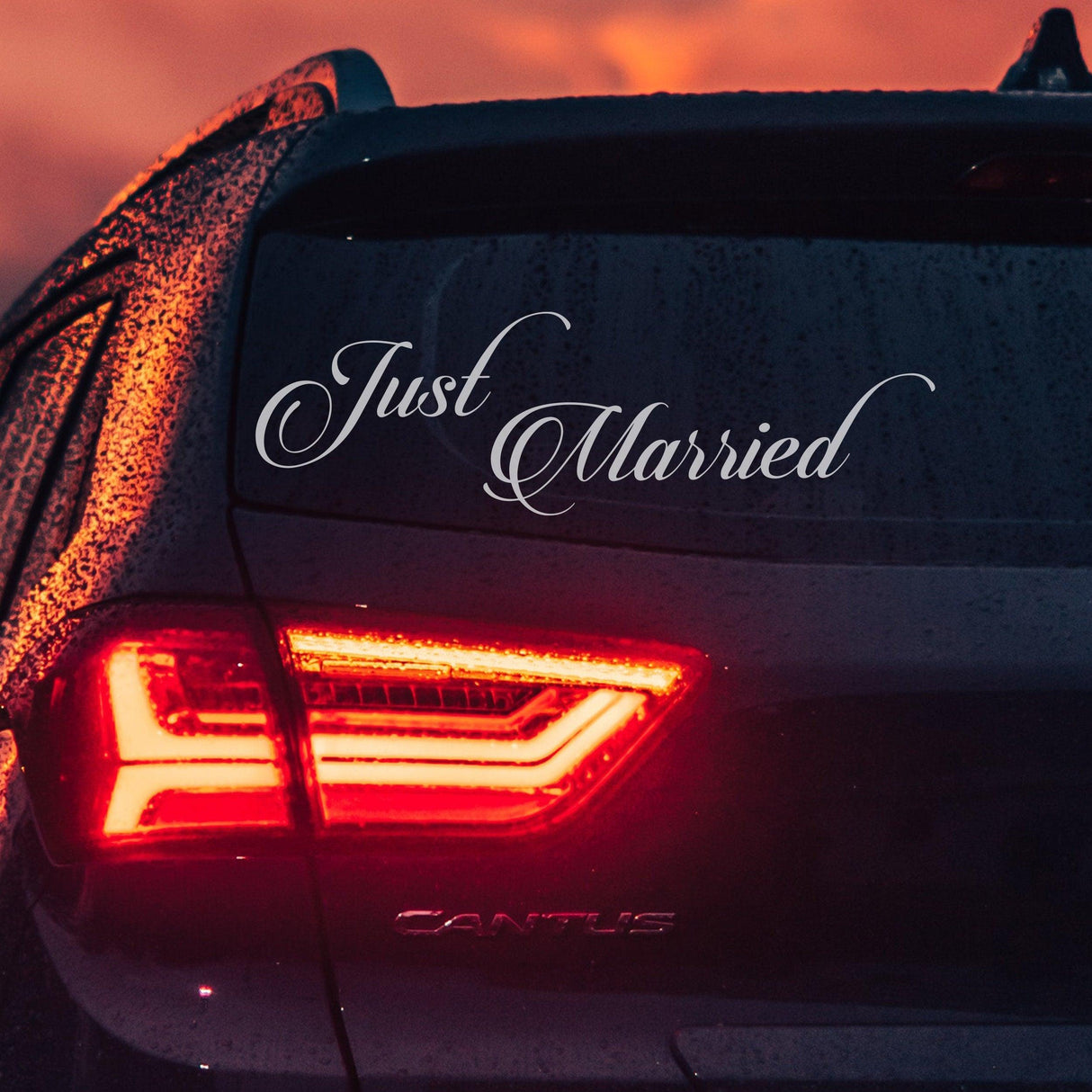 Just Married car vinyl decal on rear window, perfect for newlyweds celebrating their special day.