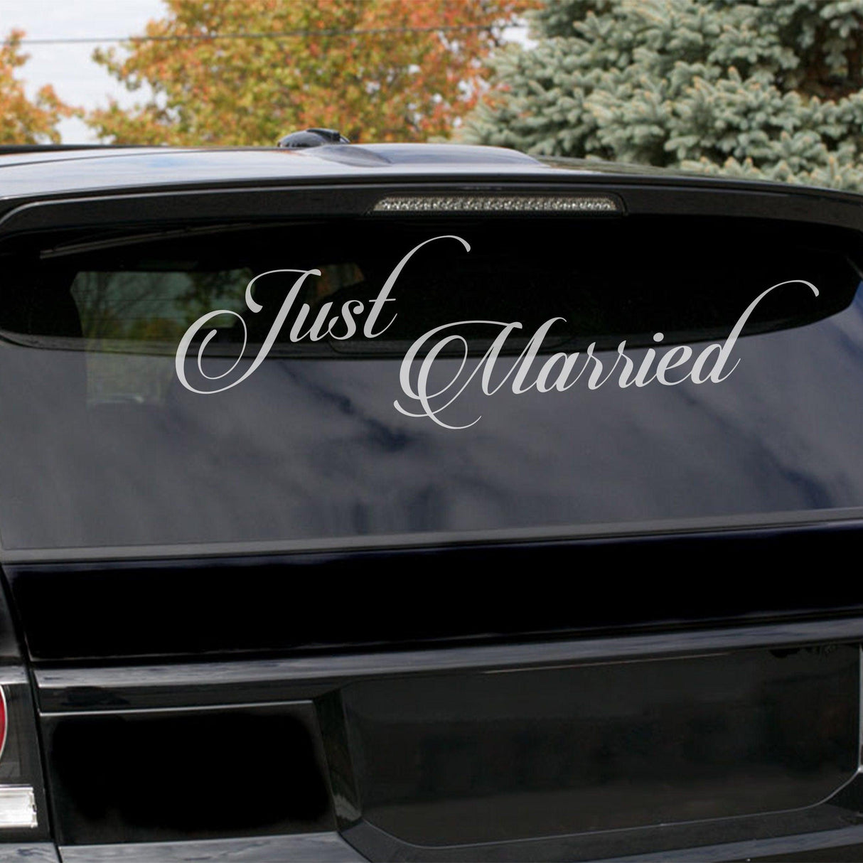 Just Married car vinyl wedding sticker displayed on a vehicle window, perfect for celebrating your special day.