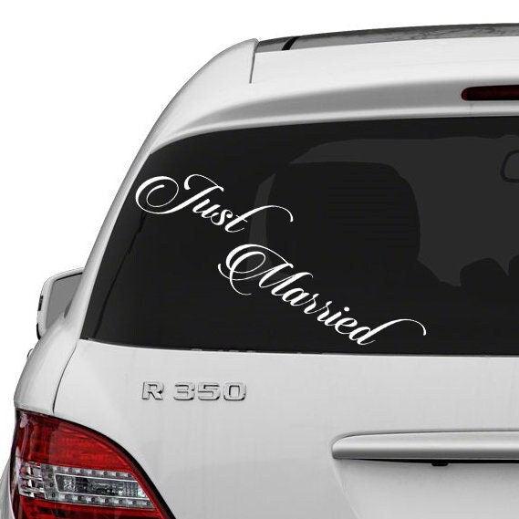 Just Married car decal sticker displayed on a vehicle window, perfect for newlywed couples celebrating their wedding.