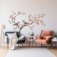 Tree wall sticker with blossom flowers and birds, elegant vinyl decor for a serene living room.