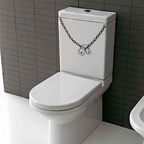 Humorous toilet decal featuring a chain and pendant design on a modern toilet.