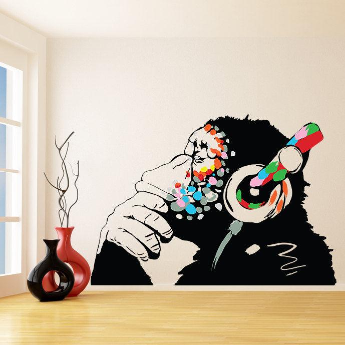 Banksy Thinking Monkey Sticker wall decal featuring a colorful monkey in headphones, adding urban art to your interior space.