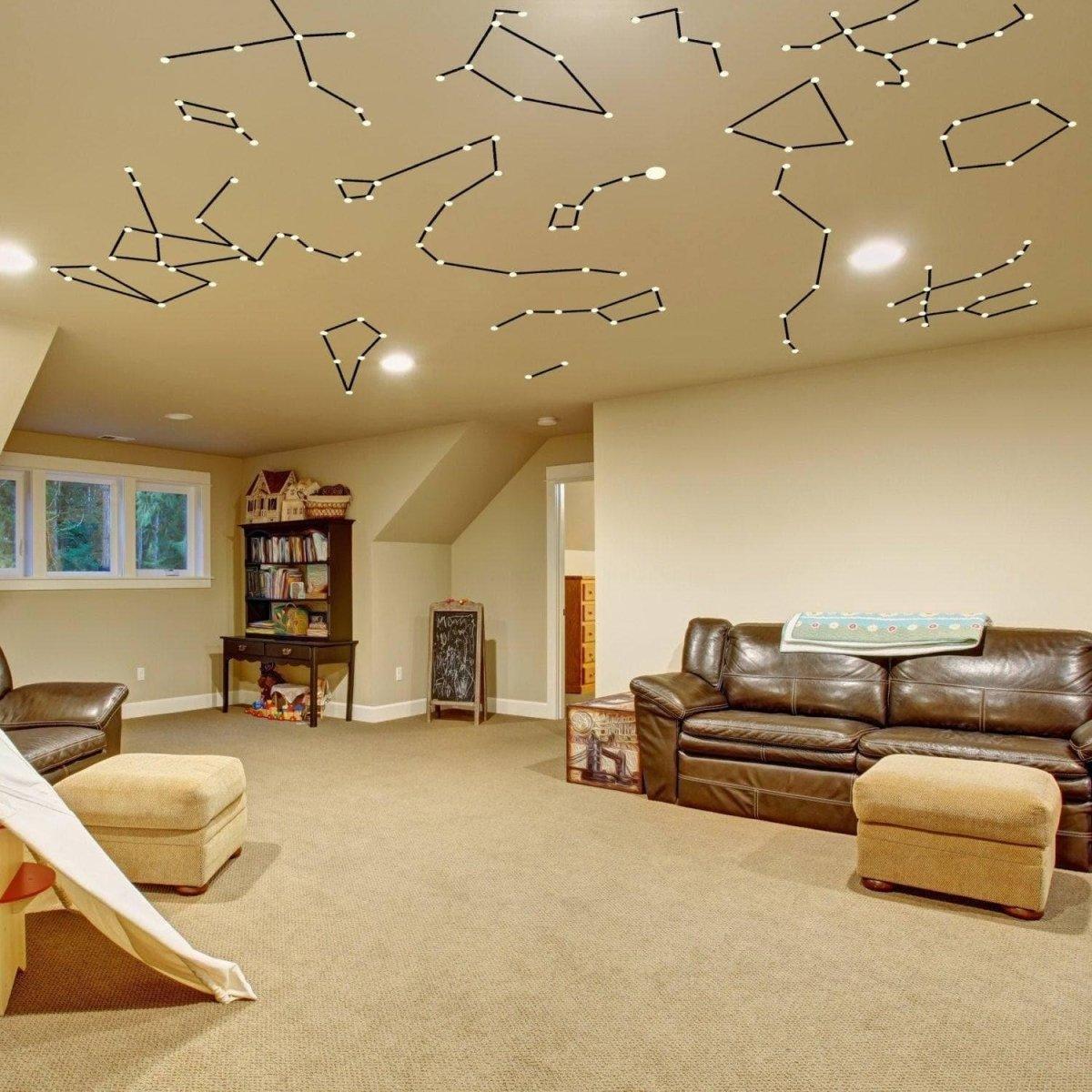 Constellation Luminary Decal Kit on ceiling in cozy living space, transforming decor with glow-in-the-dark star stickers.