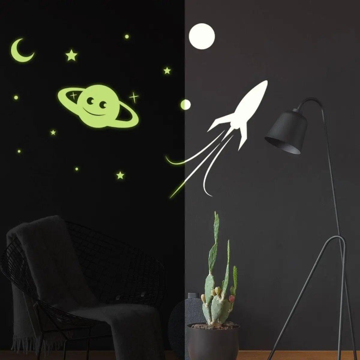 Glow in the Dark star wall stickers with a happy planet and rocket on a dark wall, perfect for cosmic decor.