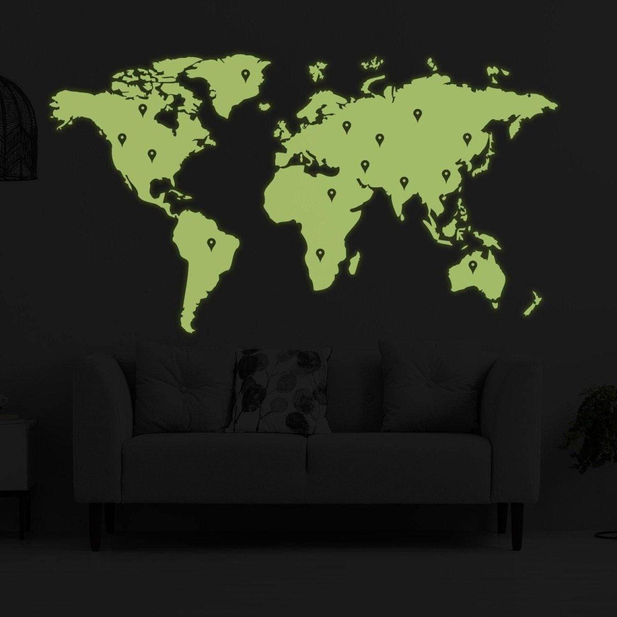 Glowing world map wall sticker in green, illuminating a dark room with stylish home decor.