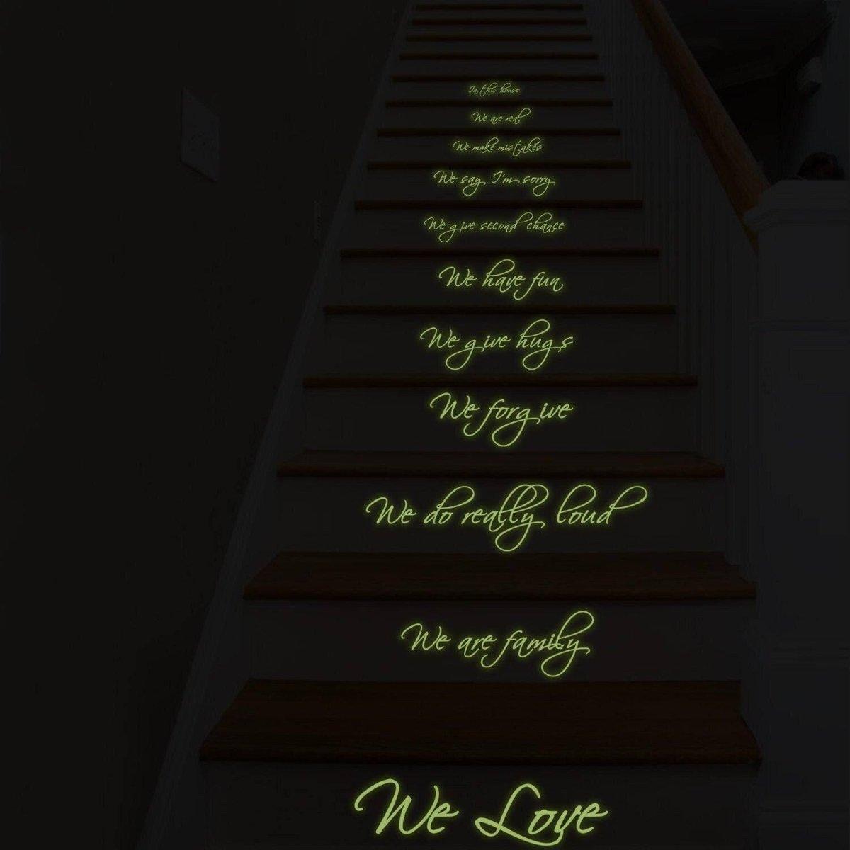 Glow-in-the-dark family quote stair decals creating a magical atmosphere at night.