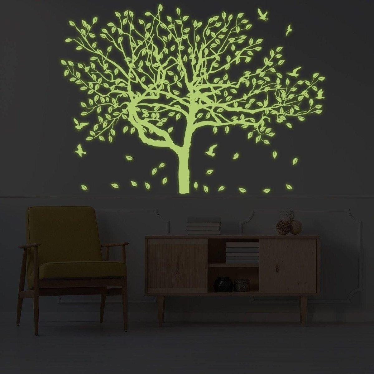 Glow-in-the-dark forest wall decal featuring luminous tree and leaves, perfect for kids' room decor.