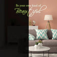 Glowing wall sticker with the quote 'Be your own kind of Beautiful' in a stylish living room setting.