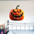 Orange pumpkin-face vinyl wall decal with a dimensional broken-wall visual effect.