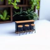 Miniature bar counter set with three stools, ideal for dollhouses and kitchen dioramas, featuring realistic design.