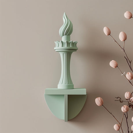 3D printed wall decor shaped like the Statue of Liberty torch, minimalist modern sculpture made of matte PLA plastic mounted on a neutral wall.