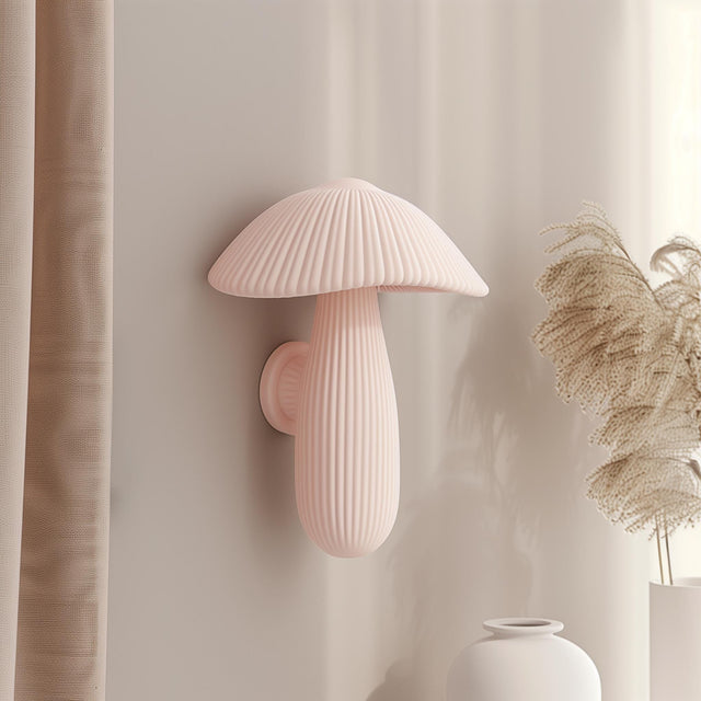 3D printed wall decor shaped like a soft pastel ribbed mushroom with elongated stem, minimalist matte PLA sculpture mounted on a neutral interior wall