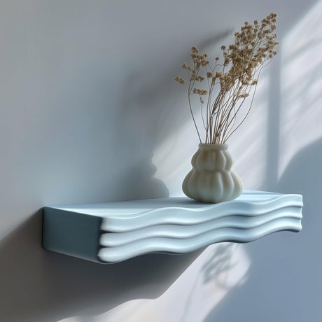 3D printed minimalist wavy wall shelf with ripple design, holding a vase, modern matte PLA texture in natural daylight
