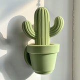 3D printed cactus-shaped wall decor made from matte PLA plastic, minimalist design inspired by nature, displayed on modern interior wall