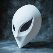 3D printed futuristic alien mask with a smooth pale surface and narrow sci-fi eye openings.