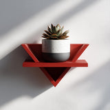 3D printed triangular wall shelf in modern design, displayed with a small potted plant, minimalist aesthetic wall decor