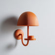 3D printed matte PLA wall-mounted mushroom shaped candle holder with a domed shade and small round platform, styled as a modern sconce on a light wall.