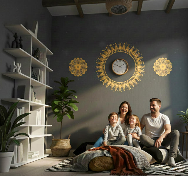 A horizontal arrangement of three golden-yellow designs on a light background. The center features a large, sharp-edged sunburst or sun symbol, with two smaller, intricate floral mandalas on either side.