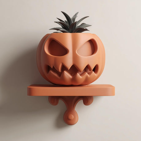 3D printed wall-mounted pumpkin face planter shelf with integrated pot and small plant, displayed on a neutral wall in soft natural light.