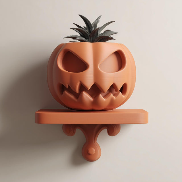 3D printed wall-mounted pumpkin face planter shelf with integrated pot and small plant, displayed on a neutral wall in soft natural light.