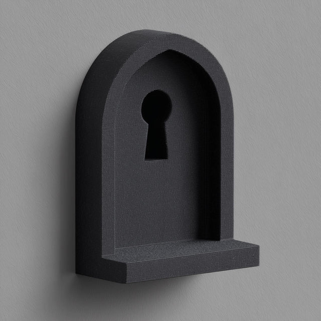 3D printed wall mounted shelf shaped like an arched niche with a keyhole cutout and a small front ledge, shown in matte dark finish on a neutral wall.