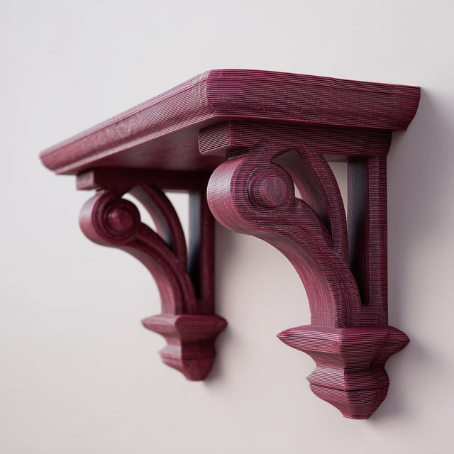 3D printed gothic corbel wall shelf with ornate carved brackets and a flat floating ledge, mounted on a clean light wall.