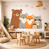 A flat-style "Kawaii" illustration of five smiling woodland animals sitting side-by-side on a white background. From left to right: a large brown bear, a grey wolf, an orange fox, a grey raccoon, and a small brown hedgehog in front. All animals have closed, happy eyes and rosy cheeks.
