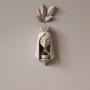 3D printed fairy face wall planter with an elongated face and crown shaped details