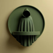3D printed hooded figure wall shelf with circular backplate and integrated front ledge