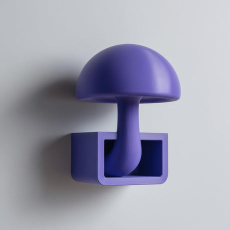 3D printed mushroom wall shelf with a domed cap and stem flowing into a small rectangular cubby tray, visible print texture, mounted on a clean wall.