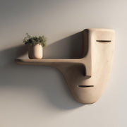 3D printed wall mounted shelf shaped like a minimalist face mask with a long nose-style floating ledge.