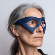 3D printed avant-garde mask glasses style eye mask with large oval eye cutouts and angular side panels, worn in a studio portrait on a neutral background.