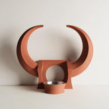 3D printed fantasy horned pet bowl holder stand with a sculptural crescent horn frame and circular opening, shown with a metal bowl insert on a clean background.