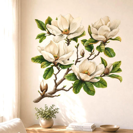 Watercolor-style wall vinyl decal of a magnolia branch with creamy white magnolia flowers, green leaves, and buds on a white background.