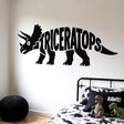 Black cartoon triceratops silhouette on a white background, with two horns, a large frill, a wide eye, and the word TRICERATOPS forming most of its body.