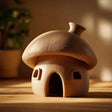 3D printed mushroom-shaped small pet hideout with arched entrance and side openings