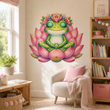 A bright green spotted frog with closed eyes sits cross-legged in meditation on a large pink lotus, wearing a crown of pink and blue flowers with green leaves.