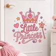 Pink “Little Princess” lettering beneath a decorative crown with a heart center, surrounded by a star-tipped magic wand, pink hearts, lavender and gold stars, dots, and sparkle accents.