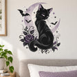 Black cat with purple eyes against a lavender crescent moon, framed by bats, stars, curling vines and a purple rose.