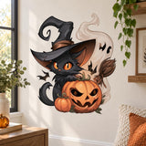 Black cat in a pointed witch hat behind a grinning pumpkin, with a smaller pumpkin, broom, bats and cream swirls.