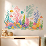 Colorful watercolor coral reef with five small tropical fish, bubbles, branching coral, sea sponges, aquatic plants, seashells, stones, and two starfish in turquoise, blue, pink, yellow, green, and coral tones.