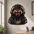 Bold illustrated raccoon with bright blue eyes and brown-and-cream facial markings, wearing a black hooded sweatshirt and large black-and-gold over-ear headphones.