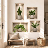 Four realistic recessed wall niches with light wood frames and warm spotlights, displaying a snake plant, flowering peace lily, trailing pothos, and ZZ plant in neutral cream and stone-style pots.