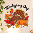 Thanksgiving Day wall decal with black cursive lettering, a cartoon turkey, orange pumpkin and red, gold and brown leaves.